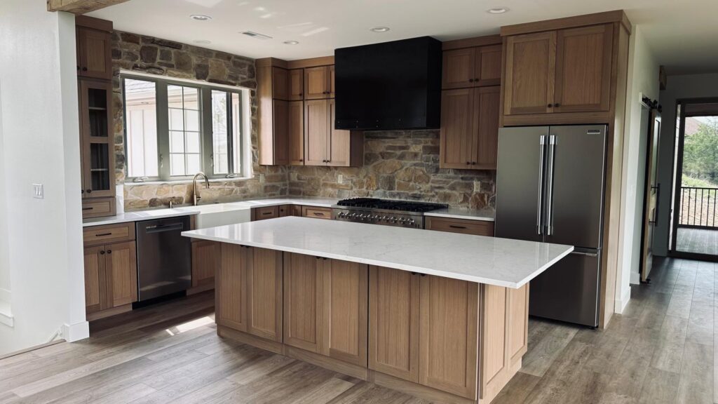 Premium white custom cabinetry in a modern Shaker style with integrated luxury appliances