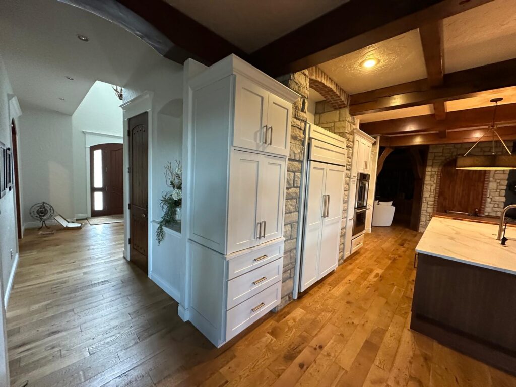 Luxury kitchen island with a marble countertop and custom handcrafted cabinetry by Max Craft
